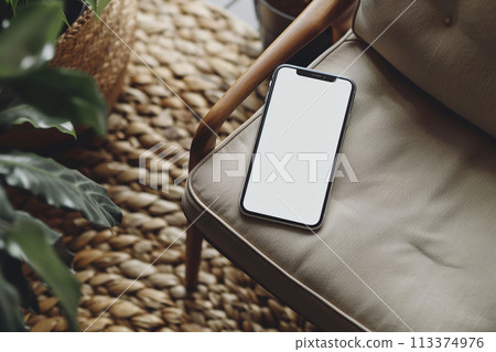 Smartphone on a Modern Armchair Smartphone on a Modern Armchair 113374976