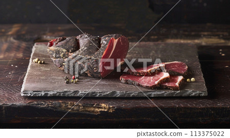 Artisanal Cured Meat on Slate Board 113375022