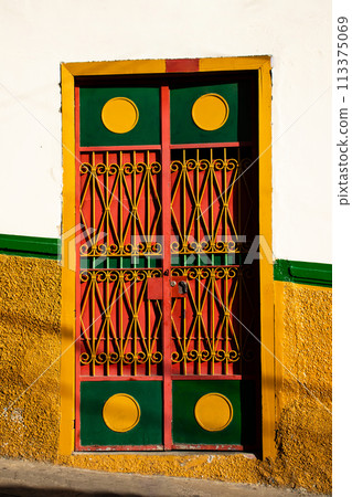 Beautiful facade of the houses at the historical downtown of the heritage town of Salamina located at the Caldas department in Colombia. Beautiful facade of the houses at the historical downtown of the heritage town of Salamina located at the Caldas department in Colombia. 113375069