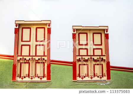 Beautiful facade of the houses at the historical downtown of the heritage town of Salamina located at the Caldas department in Colombia. 113375083