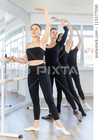 Girls in ballet class perform Batman with participation of mature female mentor 113377098