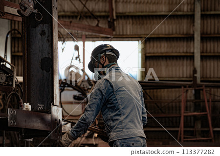Steel factory worker 113377282