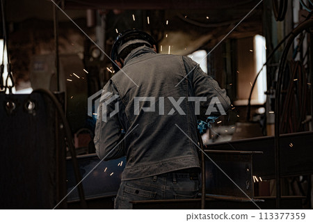 Steel factory worker 113377359