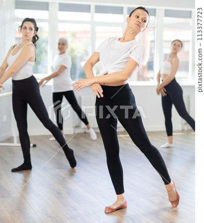 Group of women rehearsing ballet dance Group of women rehearsing ballet dance 113377723