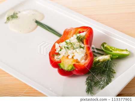 Stuffed half of pepper with brynza, dish of Bulgarian cuisine Stuffed half of pepper with brynza, dish of Bulgarian cuisine 113377901