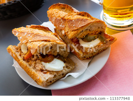 Sandwich with eggs, anchovies Sandwich with eggs, anchovies 113377948