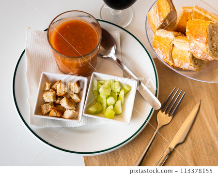 Gazpacho in glass spanish tomato based cold vegetable soup served with cucumbers 113378155