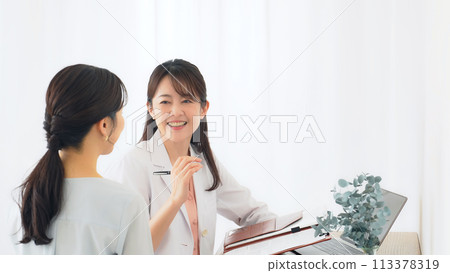 Female doctor examining patients 113378319