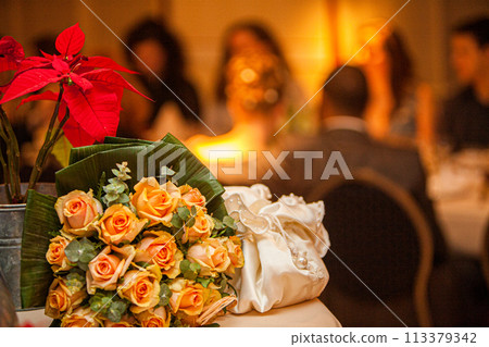 Elegant Wedding Table Setting with Roses and Poinsettia Elegant Wedding Table Setting with Roses and Poinsettia 113379342