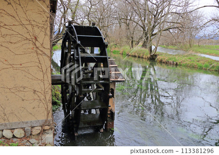 Azumino in early spring, a watermill at Daio Wasabi Farm Azumino in early spring, a watermill at Daio Wasabi Farm 113381296