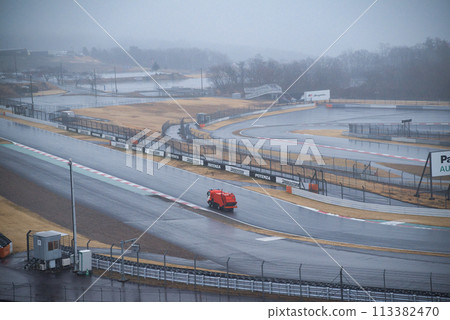 Cleaning trucks running on the circuit in the morning Cleaning trucks running on the circuit in the morning 113382470
