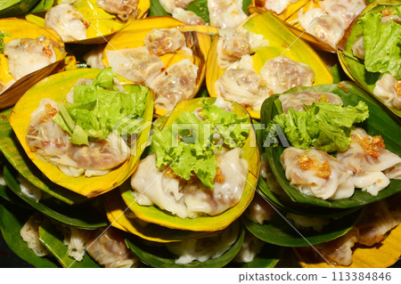 Thai Steamed Pork Dumplings Thai people call Kow Griep Pag Mor on banana leaf for sale 113384846