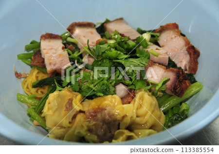 Egg noodle with red roast pork and crispy pork 113385554