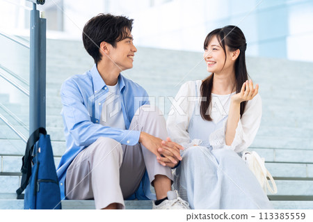 A college student couple enjoying campus life A college student couple enjoying campus life 113385559
