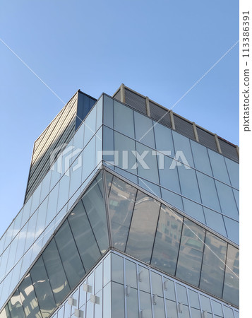 Reflection of modern architecture in windows of office building, business concept 113386391