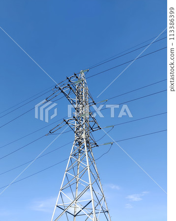 High-voltage tower on blue sky background High-voltage tower on blue sky background 113386399
