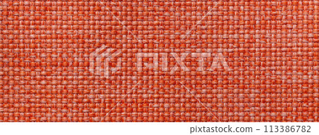 Texture of dark orange background from woven textile material with wicker pattern, macro. Vintage red fabric Texture of dark orange background from woven textile material with wicker pattern, macro. Vintage red fabric 113386782