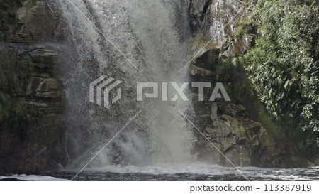 Slow Motion Waterfall Base with Splashing Torrent and Rocks 113387919