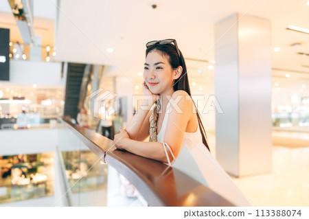 Asian woman happy smile face at indoors department store gen z city lifestyles 113388074