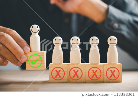 Hand of a businessman touches wooden cube with a check mark symbolizing employment choice. Illustrates business service rating and satisfaction concept. Think With Yes Or No Choice. Hand of a businessman touches wooden cube with a check mark symbolizing employment choice. Illustrates business service rating and satisfaction concept. Think With Yes Or No Choice. 113388301
