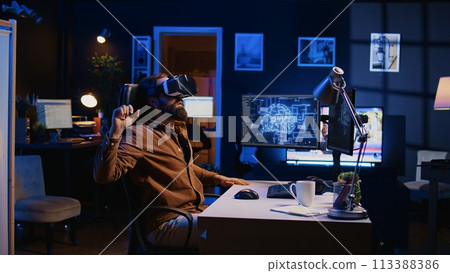 Developer wearing VR headset panicking after AI mind gains sentience, hastily removing goggles and altering lines of code. Admin scared by artificial intelligence gaining consciousness, camera B 113388386