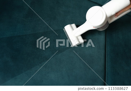 Cleaning service washing furniture with vacuum cleaner at home closeup Cleaning service washing furniture with vacuum cleaner at home closeup 113388627