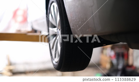 Closeup of rubber tires on car wheel 113388629