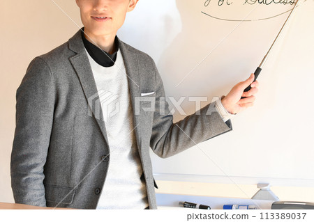 Male seminar lecturer wearing a suit to give a presentation Male seminar lecturer wearing a suit to give a presentation 113389037