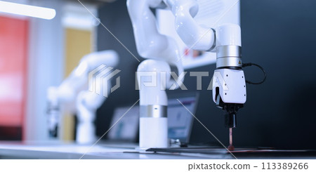 Robot manipulator on table in industrial technical testing laboratory closeup Robot manipulator on table in industrial technical testing laboratory closeup 113389266
