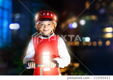 Safety on dark street. Kids reflective vest. 113391011