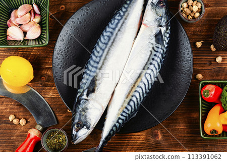 Raw mackerel fish on wooden background. 113391062