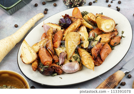 Baked parsnip root and carrots. Baked parsnip root and carrots. 113391078