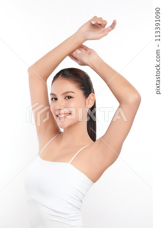 Beautiful Young Asian woman lifting hands up to show off clean and hygienic armpits or underarms on white background, Smooth armpit cleanliness and protection concept Beautiful Young Asian woman lifting hands up to show off clean and hygienic armpits or underarms on white background, Smooth armpit cleanliness and protection concept 113391090