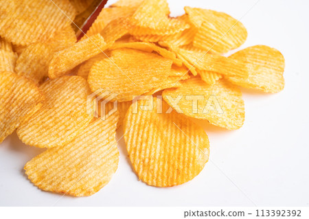 Potato chips, delicious BBQ seasoning spicy for crips, thin slice deep fried snack fast food in open bag. Potato chips, delicious BBQ seasoning spicy for crips, thin slice deep fried snack fast food in open bag. 113392392