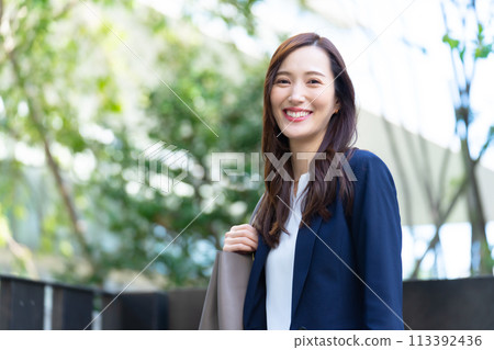 Looking up at a business woman Looking up at a business woman 113392436