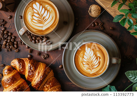 Creamy latte art. Two mugs of latte with croissants. Delicious and pleasant breakfast. 113392773
