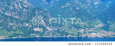 Mountain landscape, picturesque mountain lake in the summer morning, large panorama. Iseo, Italy Mountain landscape, picturesque mountain lake in the summer morning, large panorama. Iseo, Italy 113393414
