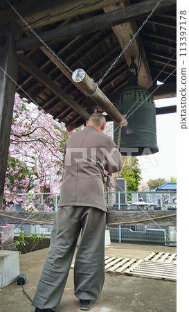 A monk announcing the time of day 113397178