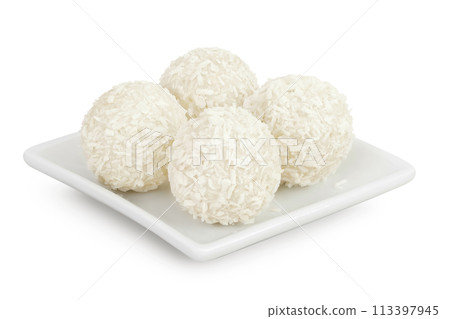 round candy raffaello with coconut flakes and nut in ceramic bowl isolated on white background round candy raffaello with coconut flakes and nut in ceramic bowl isolated on white background 113397945