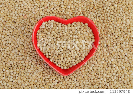 background of sorghum seeds with ceramic bowl. Top view. Flat lay. background of sorghum seeds with ceramic bowl. Top view. Flat lay. 113397948