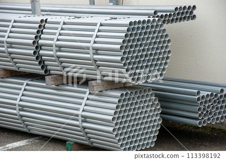 Single-tube pipes bundled together in a materials storage area 113398192