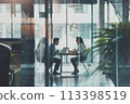 Two experts conversing at a modern workplace during a corporate gathering 113398519