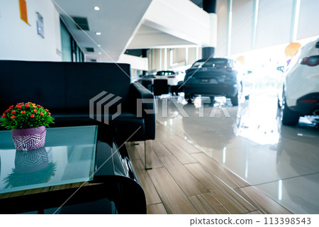 Rear view of new car parked in luxury showroom. Closeup new car parked in modern showroom. Automobile leasing and insurance background. Automotive industry. Auto leasing business. Electric vehicle. 113398543