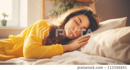 Young woman lying in bed and sleeping. 113398841
