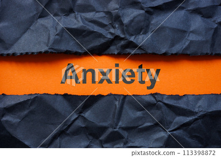 Torn crumpled paper and word anxiety. 113398872