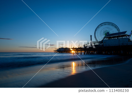 Ferris wheel dyed at sunset 113400230