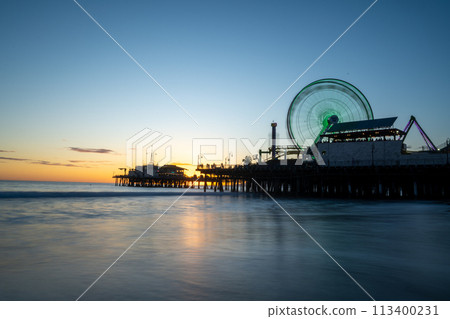Ferris wheel dyed at sunset Ferris wheel dyed at sunset 113400231