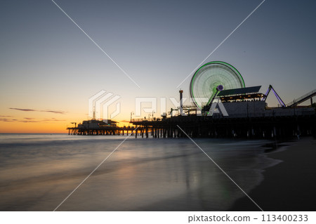 Ferris wheel dyed at sunset Ferris wheel dyed at sunset 113400233