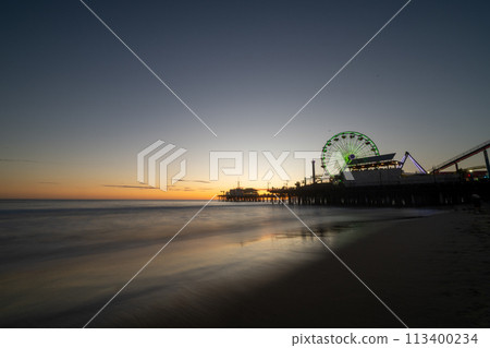 Ferris wheel dyed at sunset Ferris wheel dyed at sunset 113400234