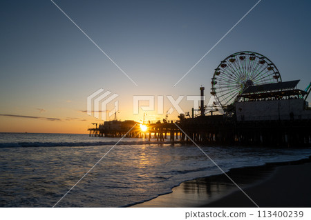 Ferris wheel dyed at sunset 113400239